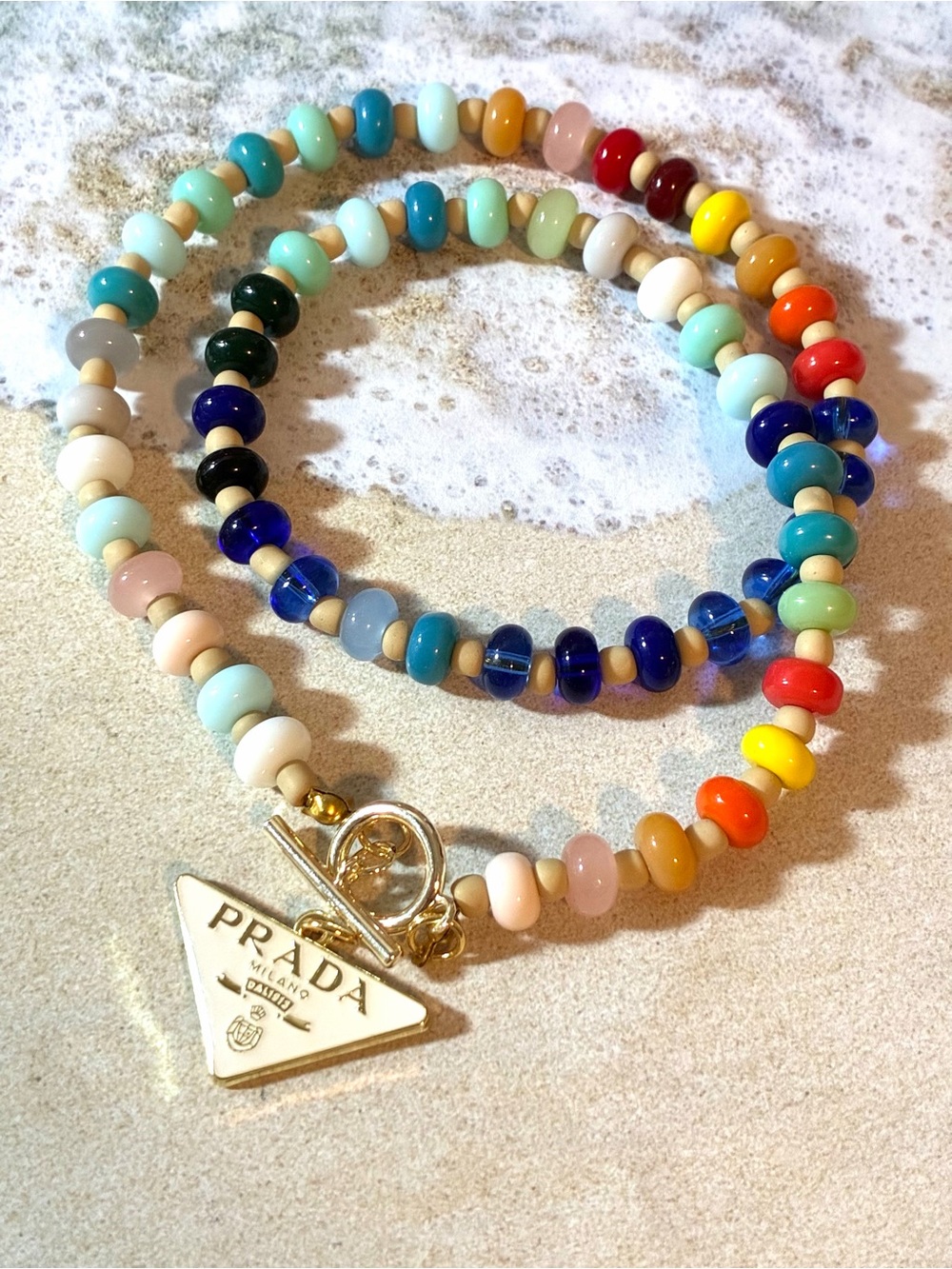 Unbranded Dopamine Rainbow Glass Bead Necklace with Gold Triangle Logo Charm.
